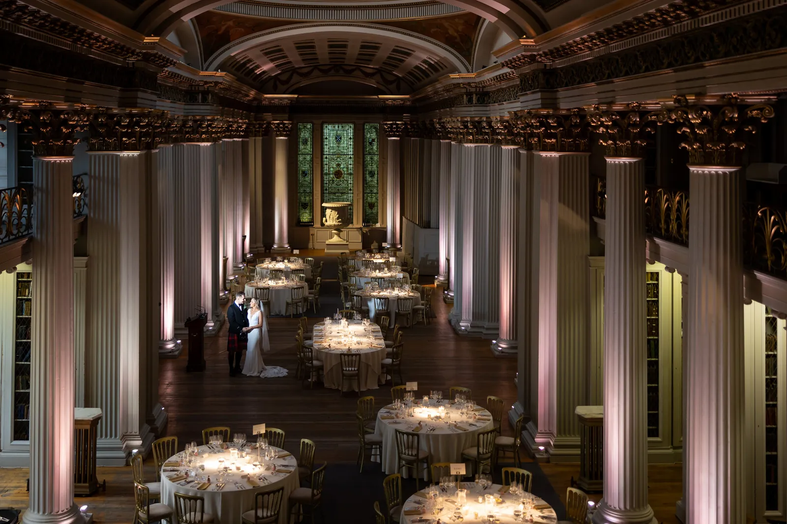 bride and groom in upper library at signet library edinburgh wedding venue