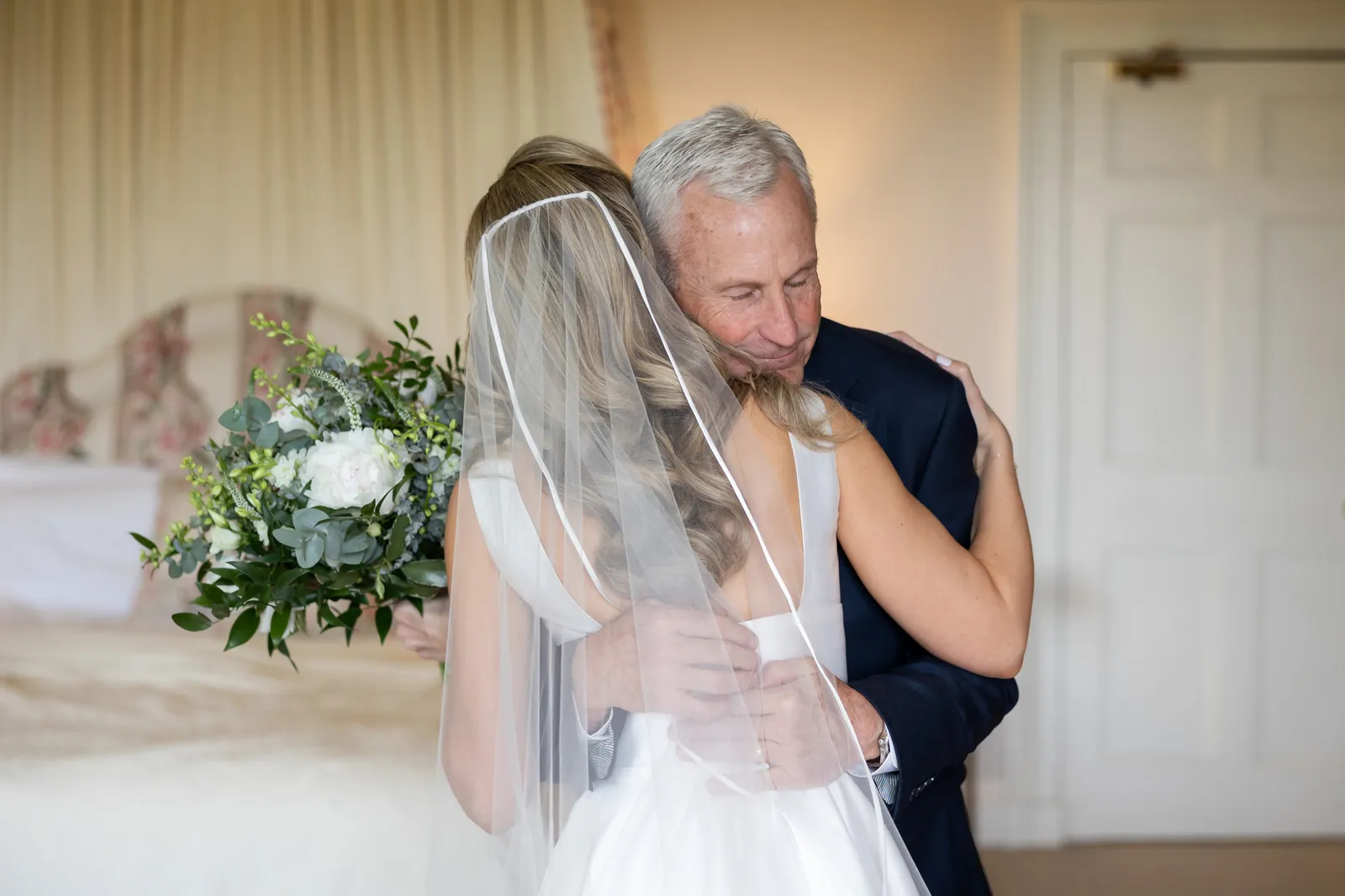 bride and father embrace dundas castle wedding