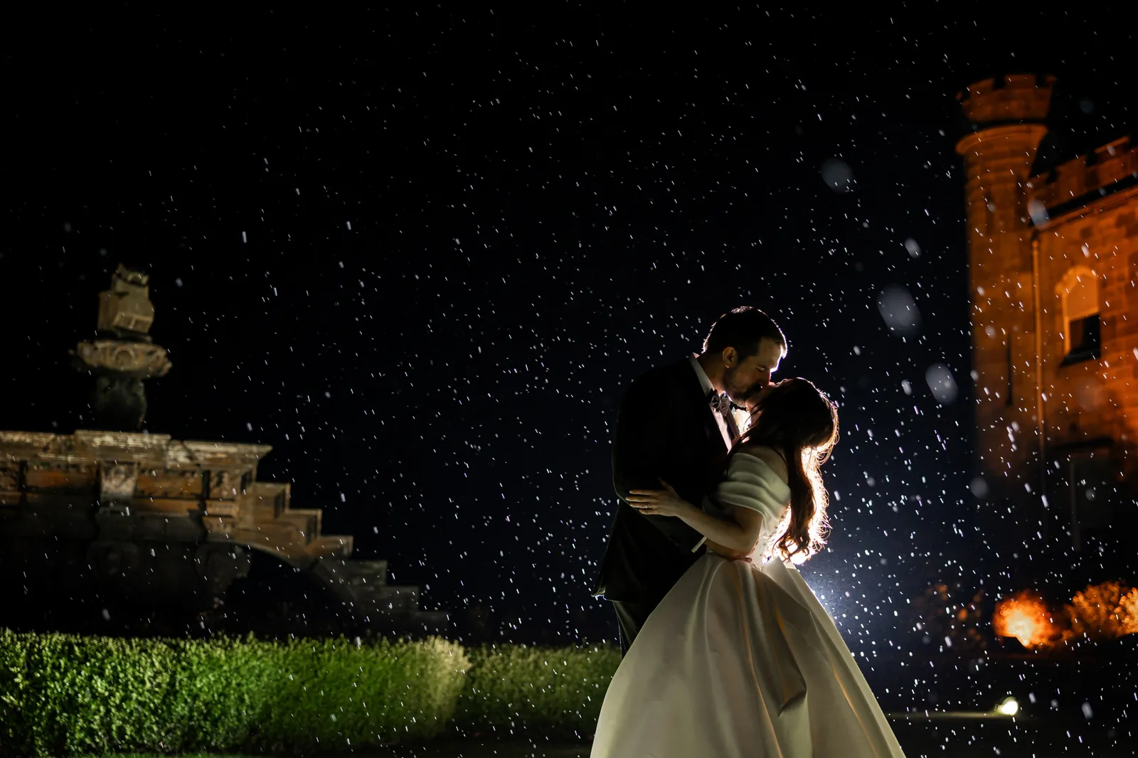 silhouette wedding photo of kissing in the rain edinburgh scotland