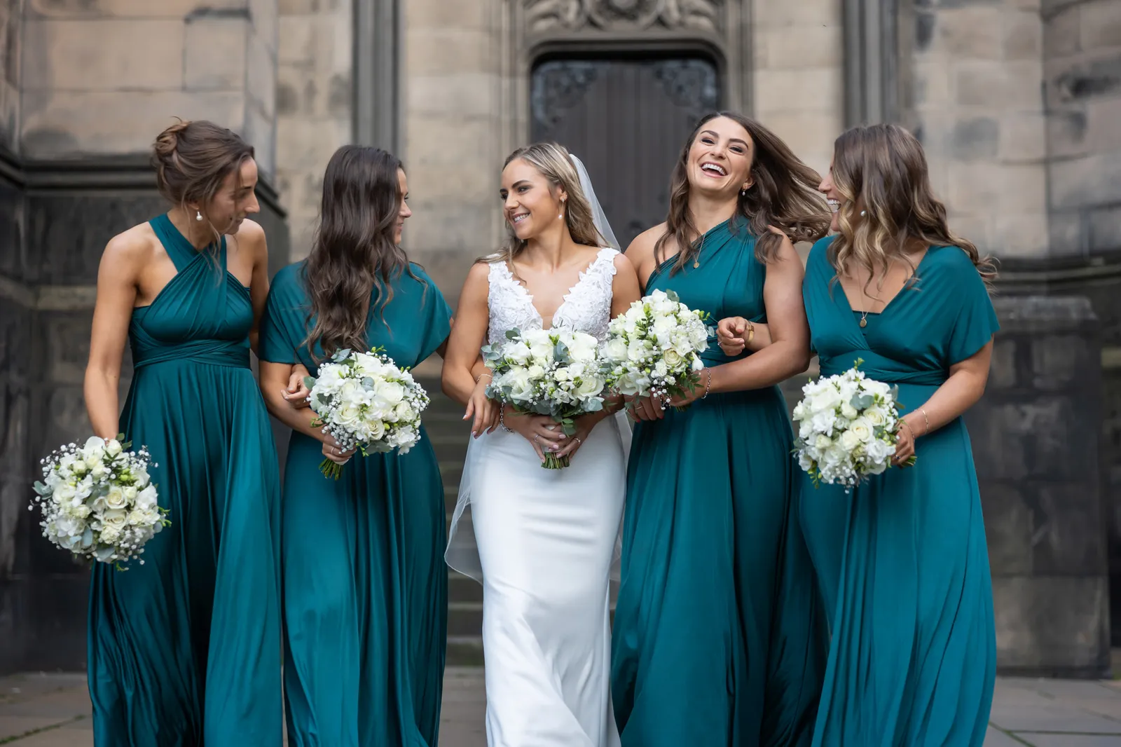 signet library wedding photo of bride and bridesmaids in teal at edinburgh city chambers wedding